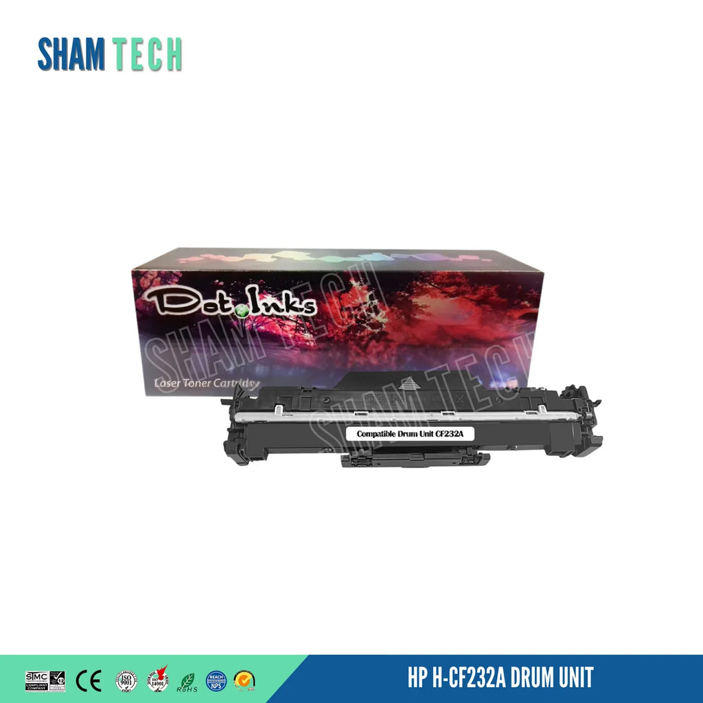 A Dot Inks compatible drum unit (model CF232A) positioned in front of its retail packaging box against a white background. The drum unit is constructed with a black plastic housing featuring a metallic top guide rail and a central label reading "Compatible Drum Unit CF232A". Behind it, the retail box displays the Dot Inks logo set against a red-and-purple forest scene topped with a rainbow gradient bar. The SHAM TECH brand logo appears in the upper-left corner with a semi-transparent watermark.