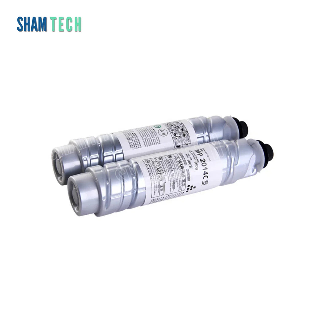 Two silver toner bottles rest horizontally, stacked slightly staggered without their box against a plain white background. Each bottle features a ribbed cylindrical body, a black cap on the right end, and a white label around the center printed with product details, warning icons, and the text "MP 2014C 型". The "SHAM TECH" logo appears in the top-left corner, and a large translucent "SHAM TECH" watermark is overlaid diagonally across the image.